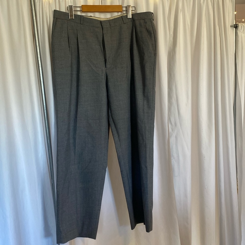Grey pleated trousers.